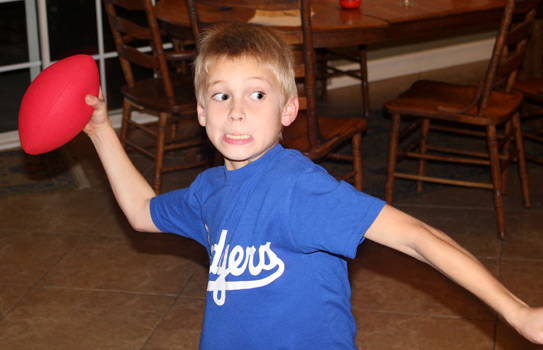 Carter gets ready to throw a pass to dad